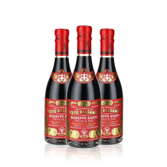 Drei Flaschen Giuseppe Giusti Aceto Balsamico Modena.