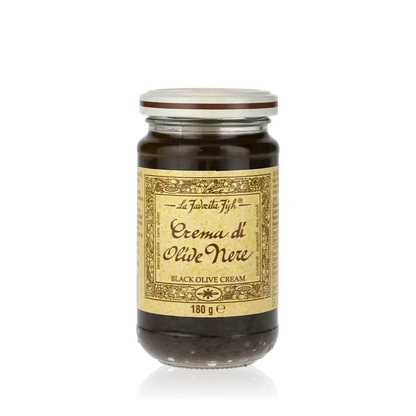 Glas mit Favorita Crema di Olive Nere Aufstrich.