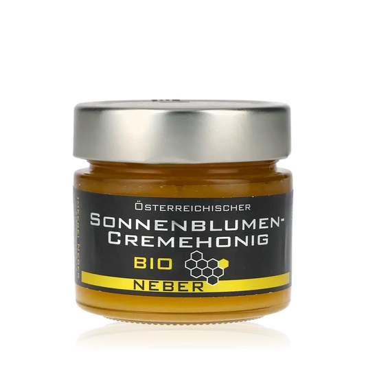 Neber Bio Sonnenblumencremehonig Glas mit schwarzem Etikett.