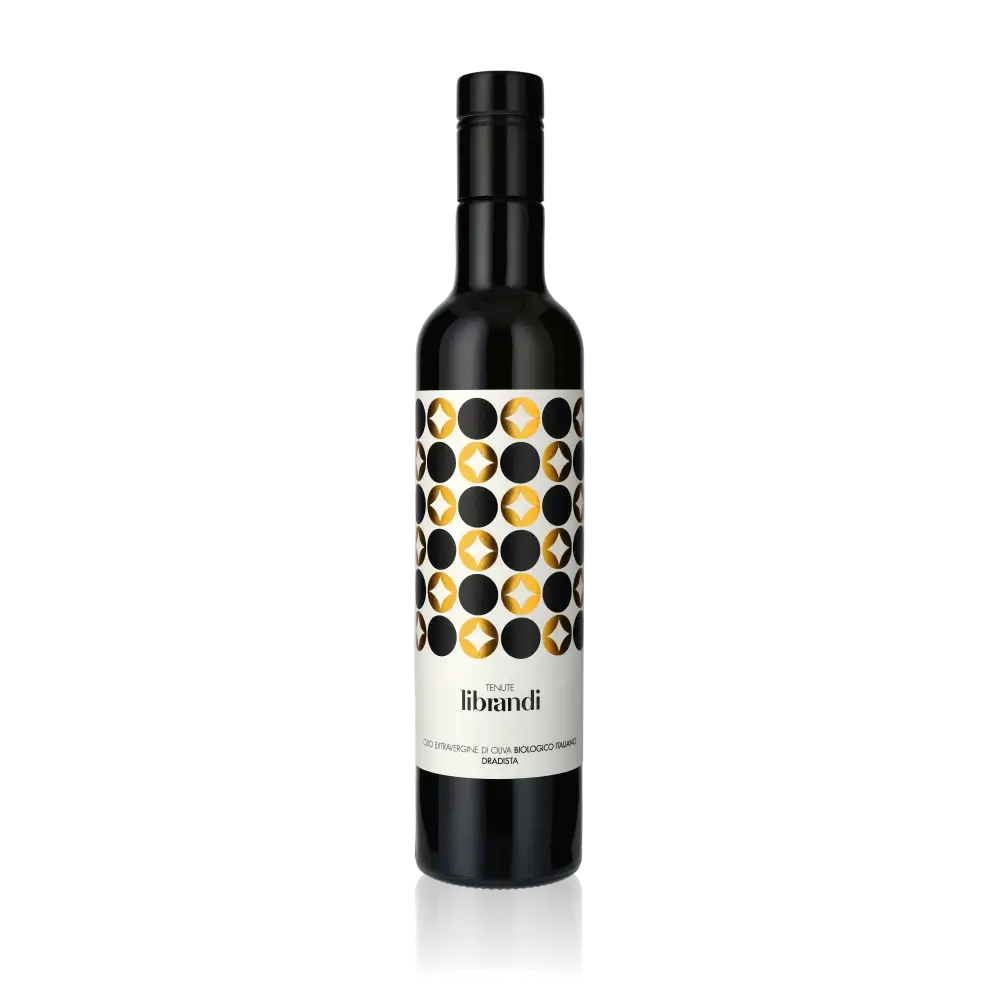 Flasche Tenute Librandi Dradista Bio-Olivenöl vor schwarzem Hintergrund.